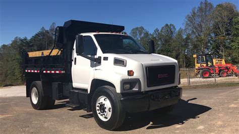 gmc truck with a dump truk skid steer|gmc trucks for sale.